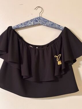 Elegant black off-the-shoulder blouse